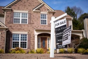 A sign announcing a home for sale is posted outside a home, Feb. 1, 2024, in Aceworth, Ga., near Atlanta. Mike Stewart/AP File Photo